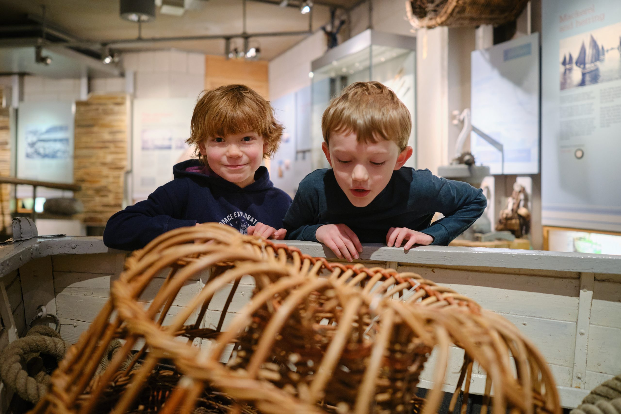 children viewing lobster pots