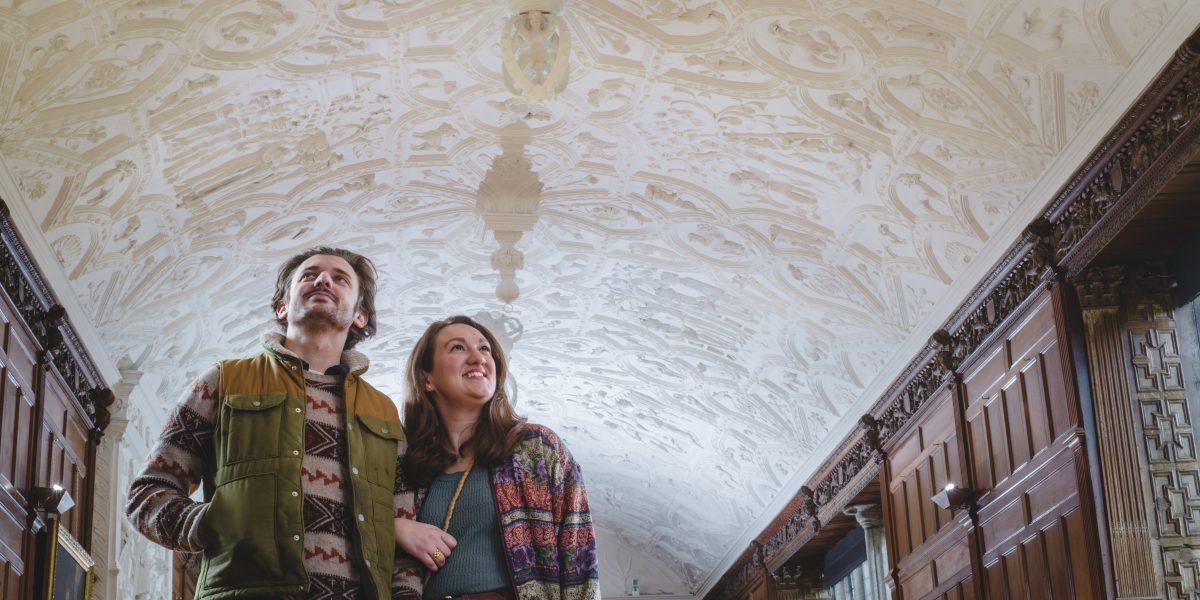 Visitors looking at the conserved Long Gallery ceiling at Lanhydrock, Cornwall(C)National Trust Images Steve Haywood