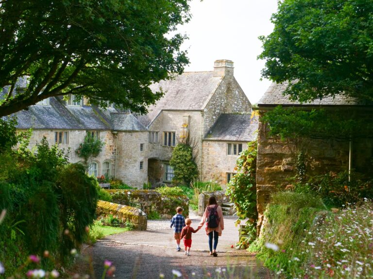 A family walking through the garden at Trerice 768x576