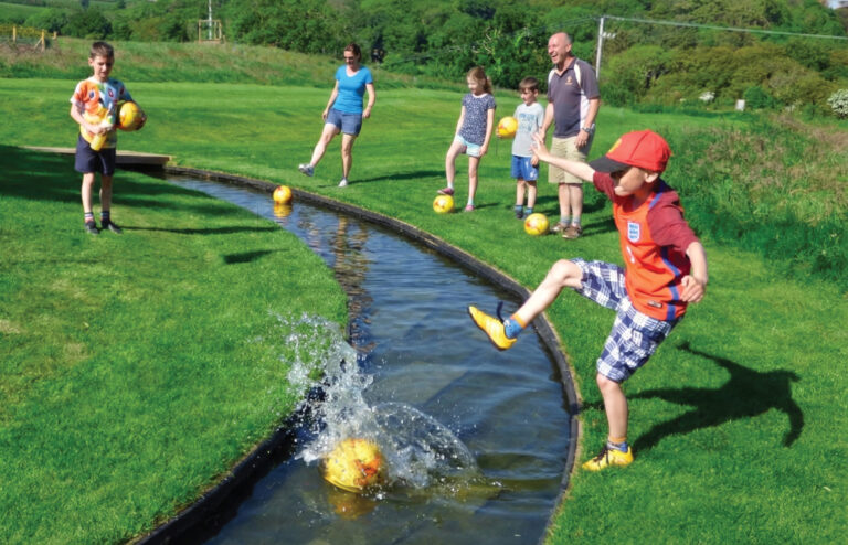 Cornwall FootballGolf Boy Splashing Water 768x494