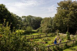 Visitors in the potager at Trerice 300x200