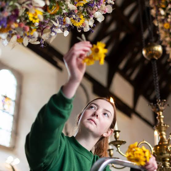 Person holding flower